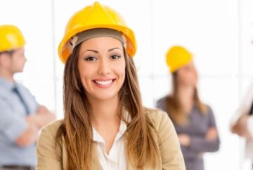 Female field service engineer in yellow hard hat working for Dutch Recruitment company in Spain